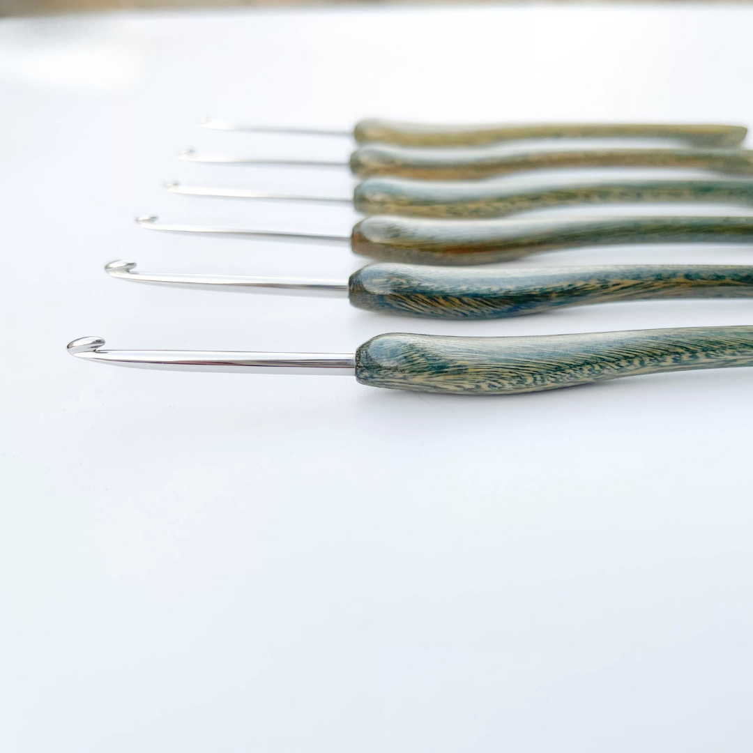 close up of hand polished micro crochet hook tip, smooth stainless steel that doesn’t snag lace thread