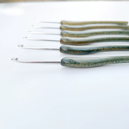 close up of hand polished micro crochet hook tip, smooth stainless steel that doesn’t snag lace thread