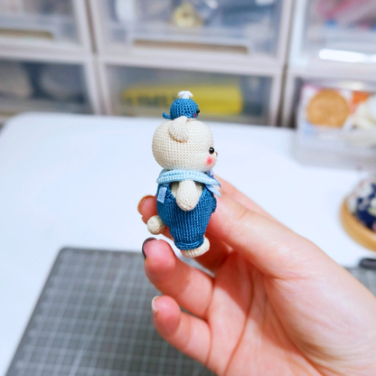 Side view of blue micro crochet bear charm – cute lightweight accessory for keychains and bags.