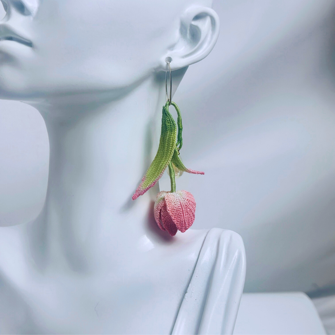 micro crochet tulip earrings worn on ear, long floral dangle style