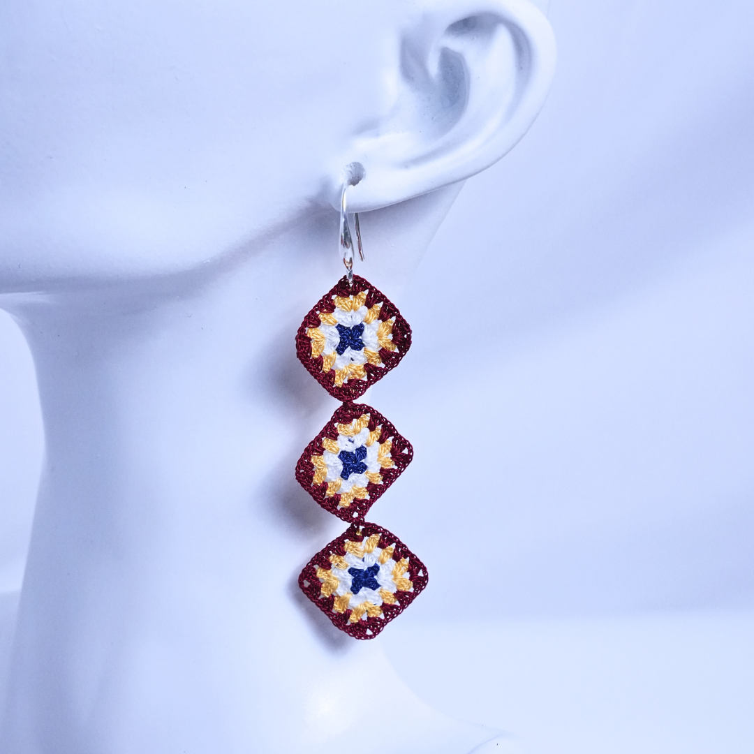 Triple granny square crochet earring worn on ear, asymmetrical handmade crochet jewelry