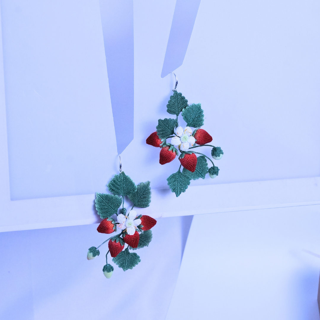 Statement micro crochet strawberry earrings displayed flat, playful cottagecore fruit earrings