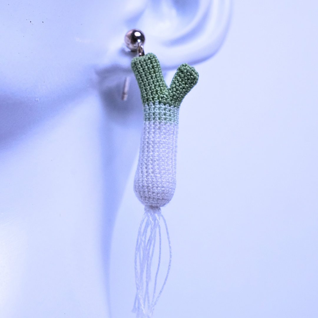 Close up detail of micro crochet scallion earring made with fine No. 100 lace thread