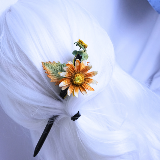 handmade crochet sunflower hair stick with ebony wood pin worn in bun hairstyle