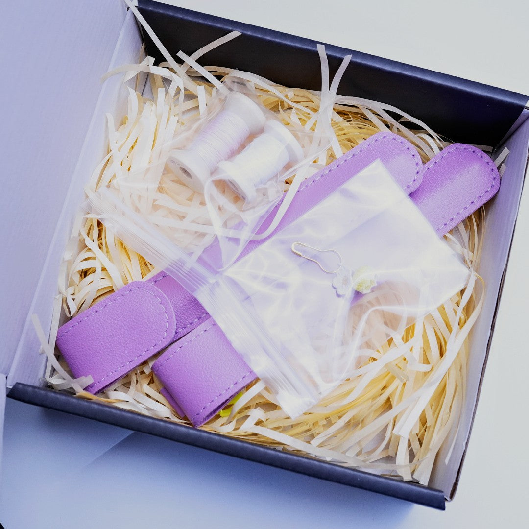 MIMO micro crochet hook packaging with lavender storage sleeves, sample threads, and accessories in a gift box