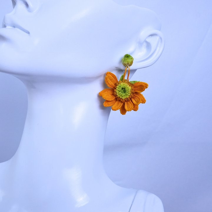 micro crochet sunflower earrings worn on ear