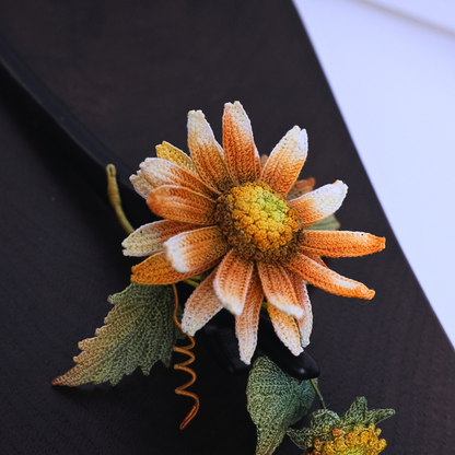 handmade crochet sunflower hair stick flat lay